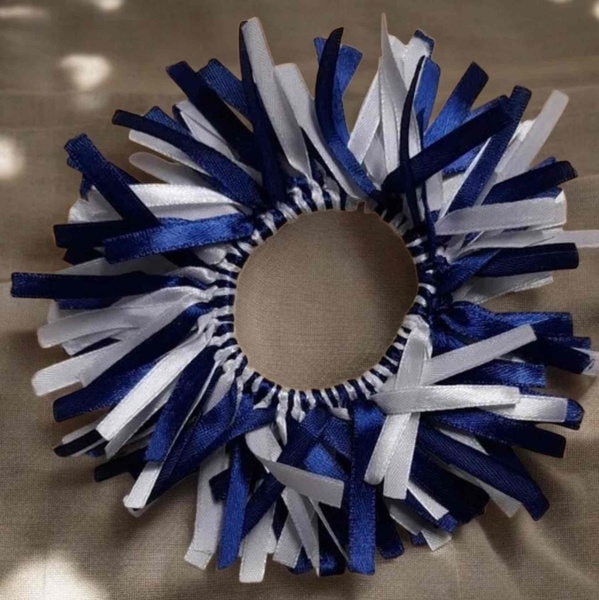 Navy blue and white ribbon scrunchie pom pom hair accessory with soft elastic center for school spirit, sports days and team hairstyles.
