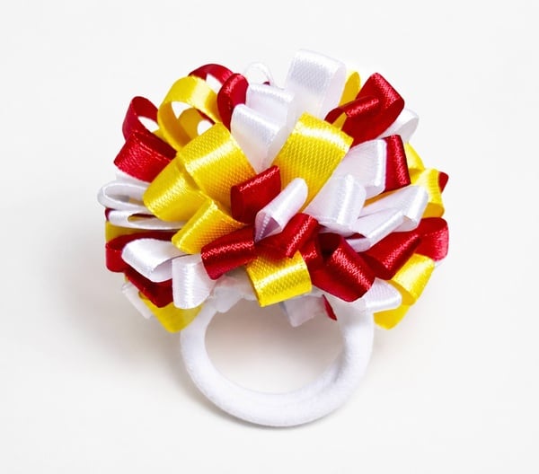 Red, white and yellow handmade satin ribbon pom pom hair bow on a soft white elastic hair tie, perfect for school and everyday wear.