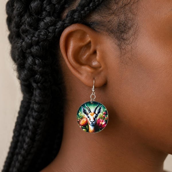 Black woman wearing South African Springbok Rugby handmade dangle earrings with hypoallergenic hooks, close-up product-focused jewellery.