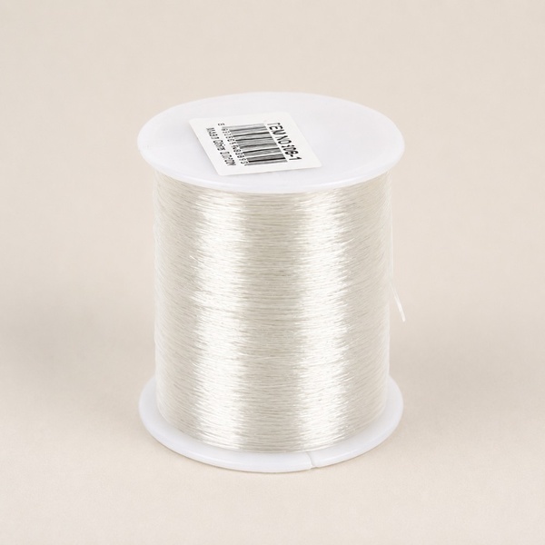 100m clear stretch elastic beading cord spool on a neutral background for jewellery making, bracelet crafting and DIY bead projects.