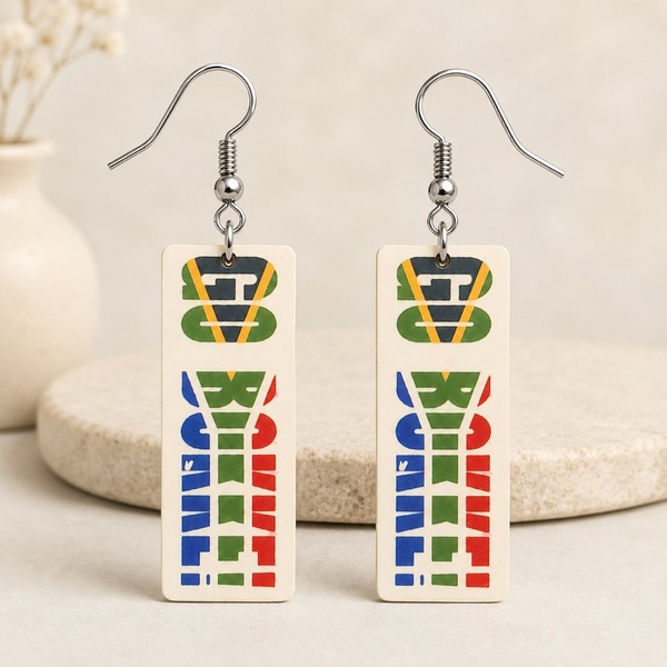 Handmade South African rugby-themed rectangular dangle earrings with silver hooks, vibrant green, gold, blue and red design on beige background.