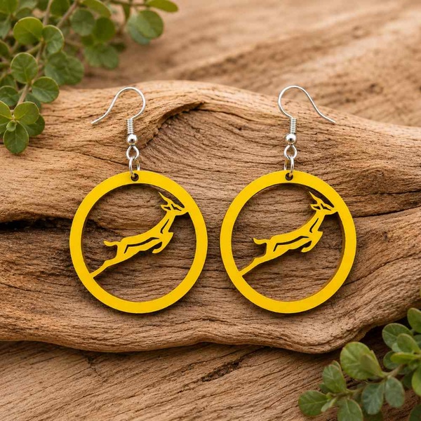 Yellow Springbok rugby earrings on natural driftwood with hypoallergenic hooks, lightweight handmade South African jewellery.
