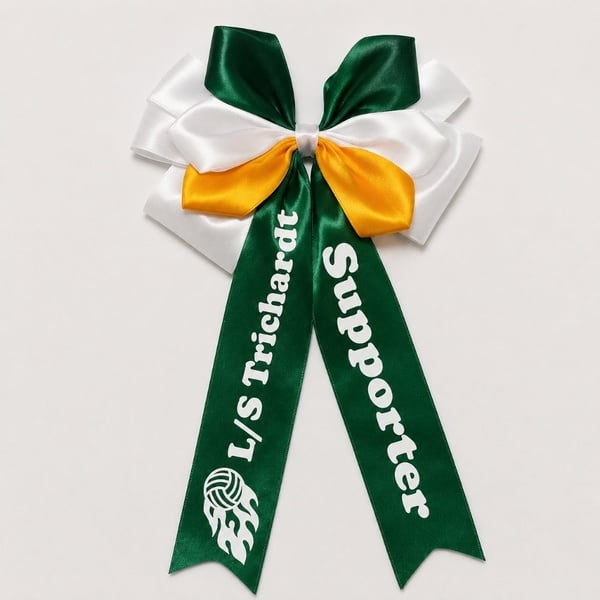 Green, white and gold satin supporter bow with custom LS Trichardt Supporter text and graphic on a soft neutral background.