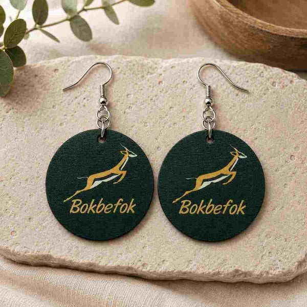 Round Bokbefok printed dangle earrings with silver hooks on natural stone, featuring green and gold antelope artwork.