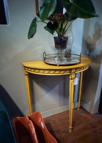 Yellow half moon table