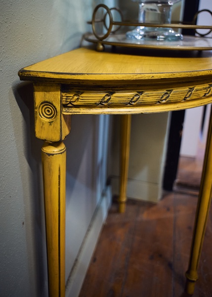 Yellow half moon table